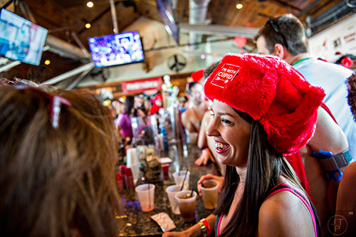 Lindsey Ebert (right) talks with friends before the start of the 2016 Cupid Undie Run at Big Sky in Buckhead on Saturday, February 13, 2016.