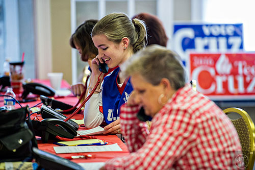 Katie Frost (center) makes phone calls to voters at the Fayette County GOP building in Fayetteville on Monday, February 15, 2016. 