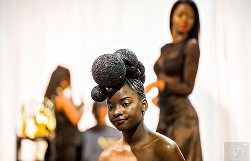 Zipporah Nichols (center) models during the Bronner Brothers International Beauty Show at the Georgia World Congress Center in Atlanta on Saturday, February 20, 2016. 