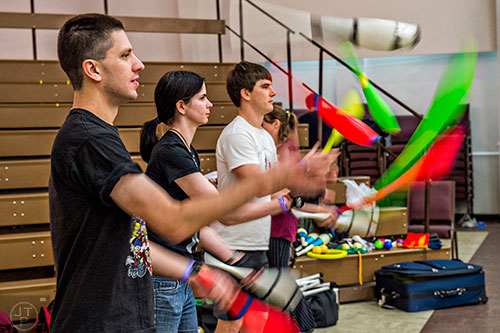Mikhel Barkan (left), Rachel Stern and Clinton Lunn juggle during the 38th annual Groundhog Day Jugglers Festival at the Yaarab Shrine Center in Atlanta on Saturday, February 6, 2016.