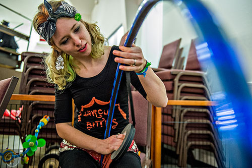 Caitlin Freeman uses tape to wrap a hula hoop during the 38th annual Groundhog Day Jugglers Festival at the Yaarab Shrine Center in Atlanta on Saturday, February 6, 2016.