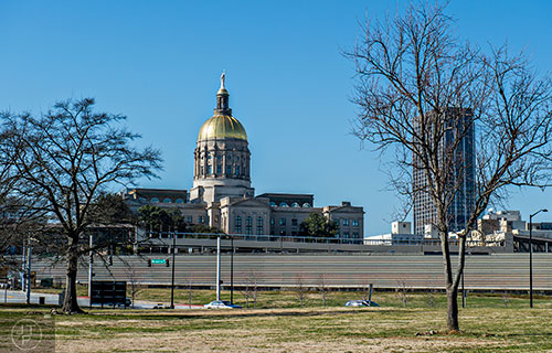 The state capitol building can be seen from the small park in front of the Capitol Gateway apartments off of Memorial Dr.