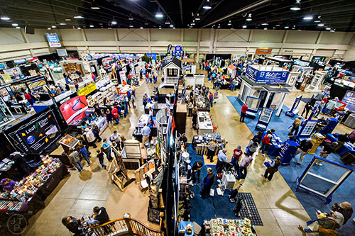 People walk through the aisles of booths during the North Atlanta Home Show at the Infinite Energy Center in Duluth on Saturday, February 20, 2016.  