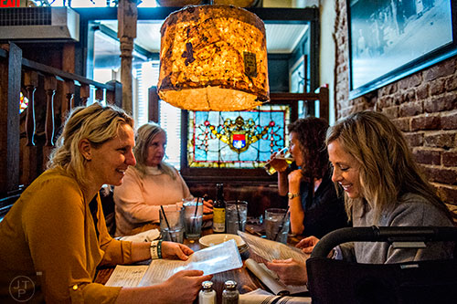 Kylene Peters (left), Candy Werner, Micky Anderson and Kirsten Jones eat lunch at Brick Store Pub in Decatur on Tuesday, February 23, 2016. Brick Store has been a Decatur staple since it opened in 1997.  