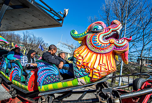 Josiah Bodden (right) and his brother Keonte ride the Orient Express at the Atlanta Fair near Turner Field in downtown on Saturday, February 27, 2016. 