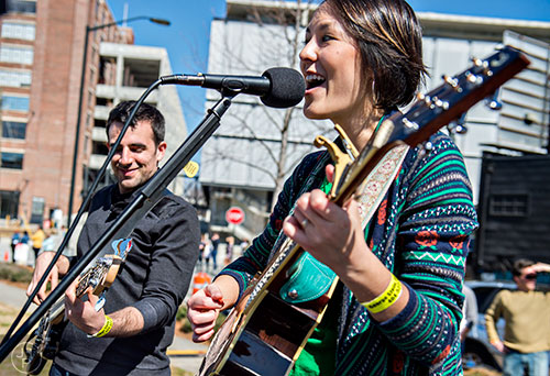 Kara Claudy (right) and Ben Williams perform on stage during the Atlanta Brunch Festival at Fourth Ward Park in Atlanta on Saturday, March 5, 2016. 