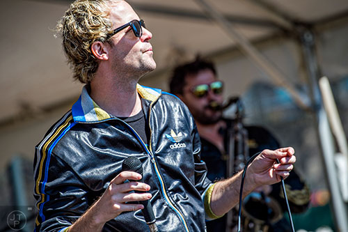 Electric Avenue's Kevin Spencer (left) and Jordan Shalhoup perform on stage during the Atlanta Brunch Festival at Fourth Ward Park in Atlanta on Saturday, March 5, 2016.