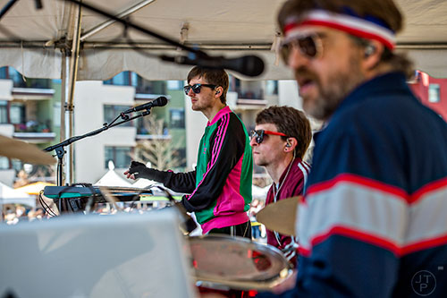 Electric Avenue's Dustin Cottrell (left), Daniel Morrison and Ganesh Giri Jaya perform on stage during the Atlanta Brunch Festival at Fourth Ward Park in Atlanta on Saturday, March 5, 2016. 