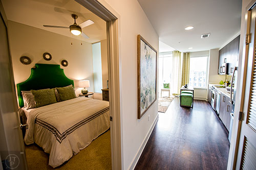 The bedroom off of the entryway in the studio model apartment at The High Rise at Post Alexander in Buckhead.