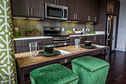 The kitchen and dining area in the studio model apartment at The High Rise at Post Alexander in Buckhead.