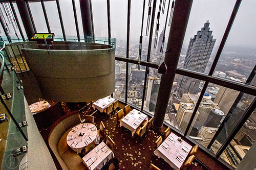 The Sun Dial on the 73rd floor of the Westin Peachtree Plaza in Atlanta is actually split into three levels, a dining room on the bottom, an observation level in the middle and a bar/lounge on top. The dining room and bar rotate giving 360 degree views of the city.