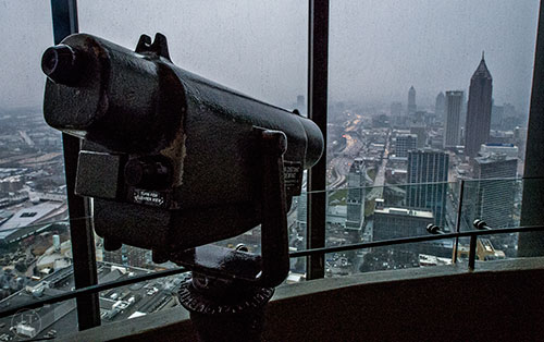 A telescope points towards the city from the observation level of the Sun Dial on the 73rd floor of the Westin Peachtree Plaza in Atlanta.