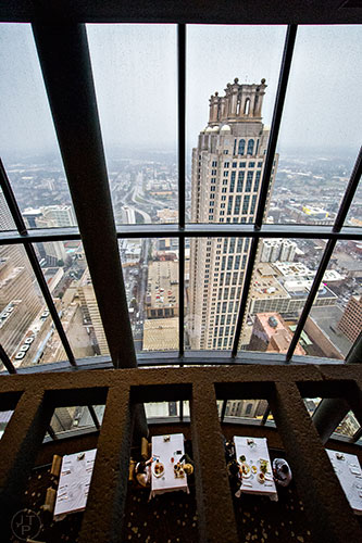The Sun Dial on the 73rd floor of the Westin Peachtree Plaza in Atlanta is actually split into three levels, a dining room on the bottom, an observation level in the middle and a bar/lounge on top. The dining room and bar rotate giving 360 degree views of the city.