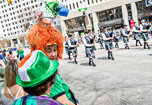 Cathy Bambenek (center) talks to Susan Herran during the annual Atlanta St. Patrick's Day Parade on Saturday, March 12, 2016. 