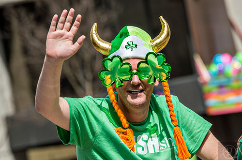 Kick 101.5's Cadillac Jack waves to the crowd during the annual Atlanta St. Patrick's Day Parade on Saturday, March 12, 2016. 