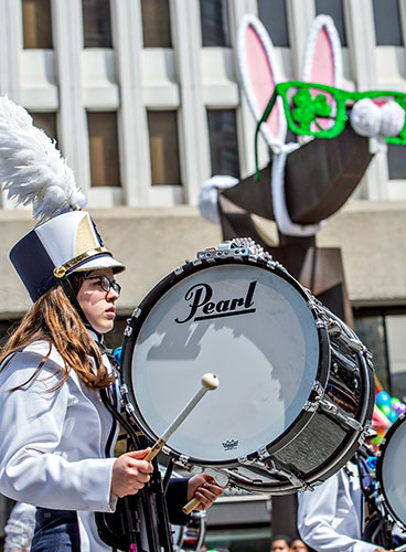 Natalie Montpas plays her bass drum as she marches down Peachtree St. during the annual Atlanta St. Patrick's Day Parade on Saturday, March 12, 2016. 
