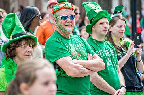 Richard Stinchfield (center) watches the annual Atlanta St. Patrick's Day Parade pass by on Saturday, March 12, 2016. 