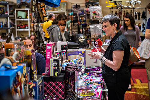 Cheryl Ric (right) purchases a Operetta doll from Monster High during Joelanta and the Great Atlanta Toy Convention at the Marriott Century Center in Atlanta on Saturday, March 12, 2016. 