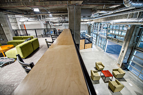 The Garage, a 9k sq. ft. clubhouse for the Tech Square community, is filled with couches, work bars, breakout rooms, whiteboards, and WiFi.
