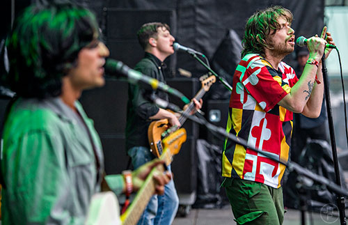 Yeasayer's Chris Keating (right), Ira Wolf Tuton and Anand Wilder perform during the first night of the Shaky Beats Music Festival at Centennial Olympic Park in Atlanta on Friday, May 20, 2016. 