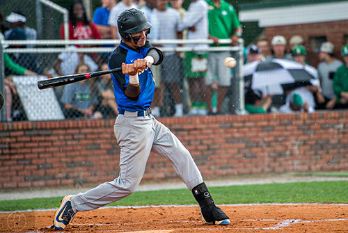Locust Grove's Odlanier Rodriguez connects with the ball during their game against Buford during the GHSA Class AAAA Championship Baseball Tournament in Buford on Saturday, May 21, 2016. 