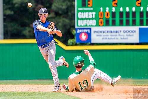 Locust Grove's Trevor Sellers (3) turns the double play as Buford's Cole Gunter (19) slides into second a little late during the GHSA Class AAAA Championship Baseball Tournament in Buford on Saturday, May 21, 2016. 