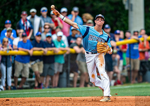 Pope's Josh Lowe tries to make the throw from third to first during the first game against Walton in the Class AAAAAA baseball championship in Marietta on Saturday, May 21, 2016. 