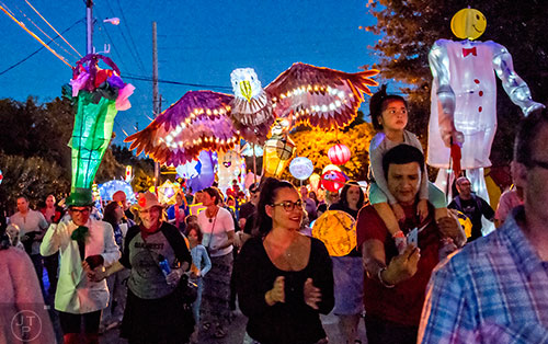 Thousands of people walk down E. Ponce during the third annual Decatur Lantern Parade on Friday.