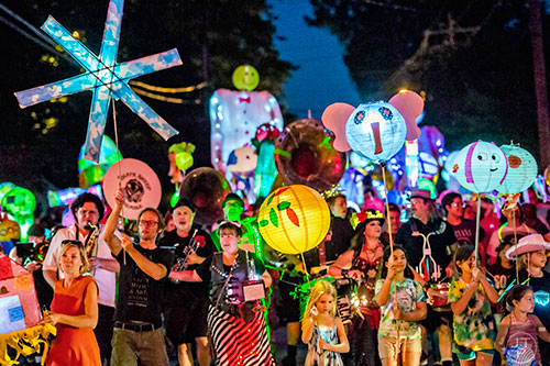 Thousands of people walk down E. Ponce during the third annual Decatur Lantern Parade on Friday.