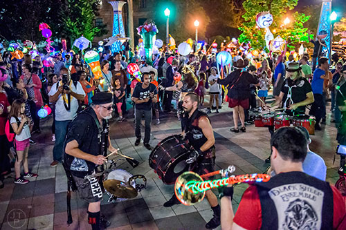The Black Sheep Ensemble play perform in Decatur Square during the third annual lantern parade on Friday.