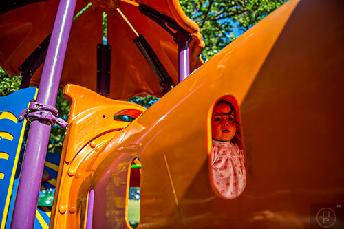 Lillian George moves through the playground at Bessie Branham Park during the Kirkwood Spring Fling on Saturday.