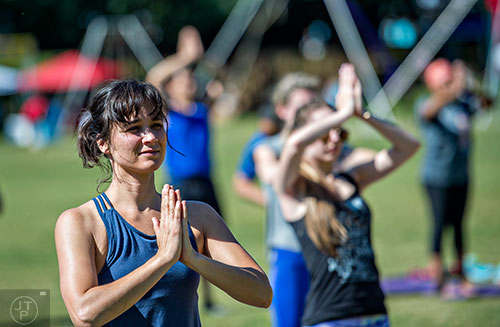 Holly Barbour practices yoga during the Kirkwood Spring Fling on Saturday.