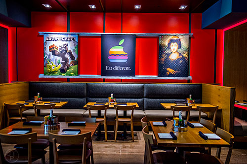 Tables and booths at Cowfish in the main dining area.