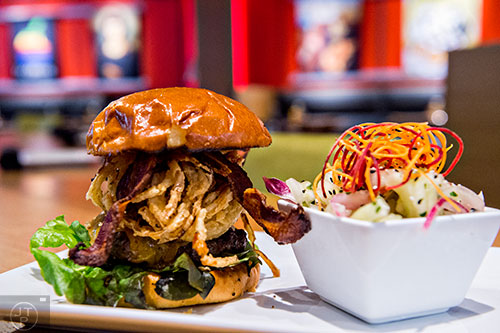 Photo: Jonathan Phillips         Cowfish serves up the Texas longhorn burger with cheddar cheese, onion strings, jalepeno bacon, tangy barbeque sauce and all of the fixings.