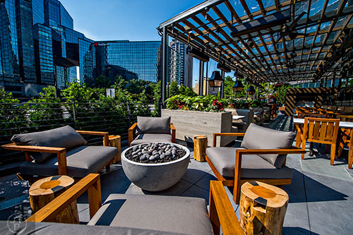 A street level outdoor patio at South City Kitchen in Buckhead has a fire place for chilly evenings.