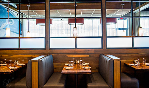 The main dining room at Noble Fin features some booth seating along the sides.