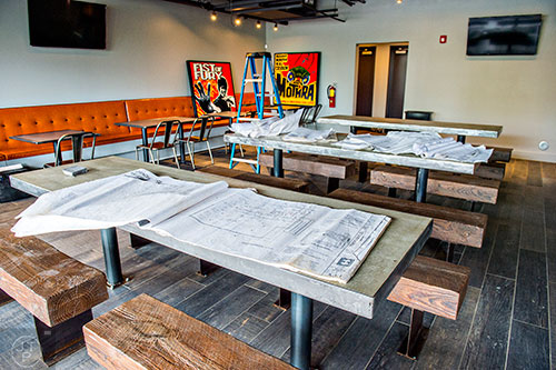 Architectural drawings lay on one of the tables inside Grind House Killer Burgers in Decatur.