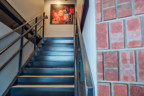 The stairwell leading to the sports bar and patio on the rooftop of Grind House Killer Burgers in Decatur.