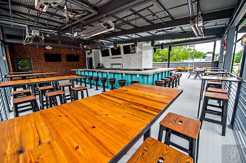 The sports bar and patio on the rooftop of Grind House Killer Burgers in Decatur.