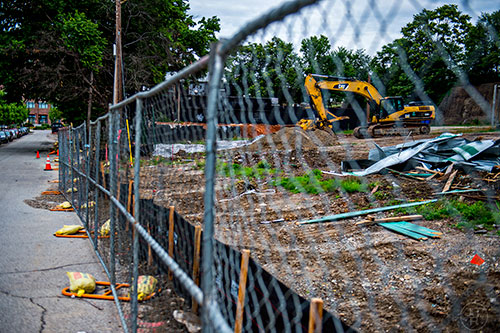 Fencing has been set up around the outside of The Masquerade off of N. Angier Ave. Heavy machinery and the remains of the green booths that once held food, beverages and merchandise during concerts are all that remain of that section of the venue.