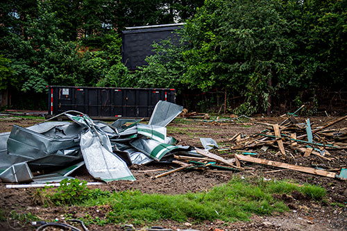 The remains of the green booths that once held food, beverages and merchandise during concerts are all that remain of that section of the venue.