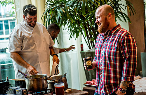 Kevin Gillespie (right) laughs with Kevin Rathbun before brunch during the Atlanta Food & Wine Festival on Sunday.