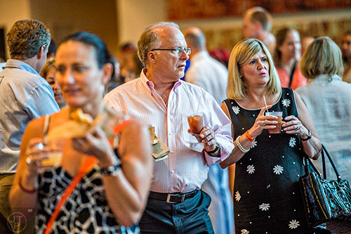 People wait for brunch with cocktails in hand during the Atlanta Food & Wine Festival on Sunday.