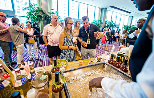 Bloody Marys are concocted as people gather for brunch during the Atlanta Food & Wine Festival on Sunday.