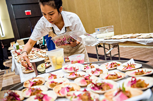 Chefs prep their brunch dishes during the Atlanta Food & Wine Festival on Sunday.