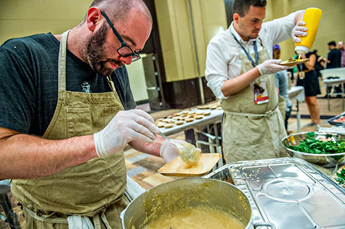 Chefs prep their brunch dishes during the Atlanta Food & Wine Festival on Sunday.