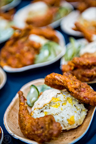 One of the dishes served at brunch during the Atlanta Food & Wine Festival on Sunday is fried quail in a Tennessee hot chicken style with a jalapeno cheddar biscuit and dill pickles.