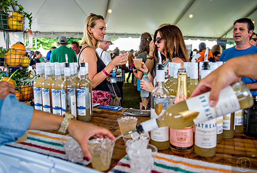 Toasting to good times with Cathead cocktails at the tasting tents in Piedmont Park during the Atlanta Food & Wine Festival on Sunday.