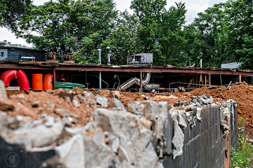 Dirt and rubble are all that remain of the stage used as The Masquerade's outdoor music park.
