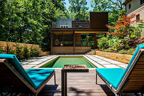 Relax by the salt water pool in the backyard at the Collier home, part of the Modern Atlanta Home Tour this year.
